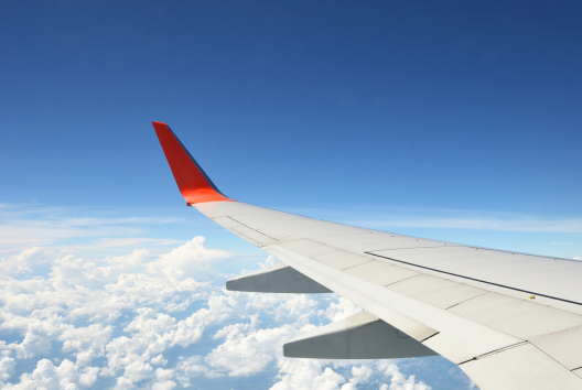 Airplane wing with red winglet.png